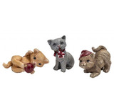 Three miniature ceramic cat figurines in various poses: one light brown lying down, one gray holding a package, and one tan