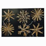Six natural straw star and snowflake ornaments on black background