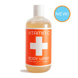 Orange bottle of Vitamin C body wash with a white cross and "NEW!" label.