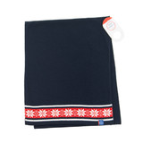 Folded navy merino wool scarf featuring a red and white Nordic snowflake border, with a product tag.