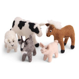 Five handmade felt farm animals including a cow, horse, goat, pig, and lamb.