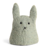 Green felt bunny egg cozy with stitched eyes and an x-shaped nose, viewed from the front on a white background.