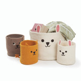 Four felt animal storage baskets in brown, yellow, and cream, featuring cute faces and ears.
