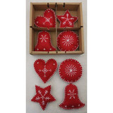 Eight red felt Christmas ornaments with white stitched designs, including hearts, stars, balls, and bells, in a gift box.