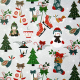Christmas wrapping paper with repeating winter icons: skates, trees, mittens, snowmen, birds, and candy canes.