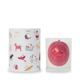 Klinta scented soy candle in glass next to its illustrated cylinder box.