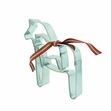 Two silver Dala horse cookie cutters tied with red, green, and white ribbon.