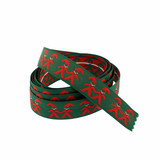Coiled dark green fabric ribbon with red Tomte Santa figures holding hands.