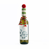 Wine bottle wearing a green and white striped knit hat with a red pompom and matching scarf.