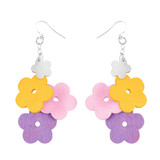 Aarikka Kukkaniitty dangle earrings featuring colorful yellow, pink, and purple wooden flowers on silver hooks.