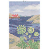 Woven tea towel with a Swedish coastal landscape, featuring red boathouses and green coastal flowers.