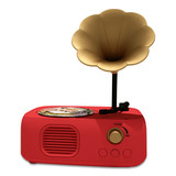 Red retro-style musical gramophone player with a gold flower horn speaker and a mini record.