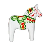 White wooden Dala horse with green, red, and yellow painted floral details. Side view.