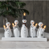 Wooden snowman candelabra with five lights; white and black with wood base.