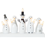 White wooden snowman candelabra with five candle lights, black accents, and wooden base.