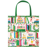 Caspari Christmas gift bag featuring holiday bookshelf illustrations and green handles.