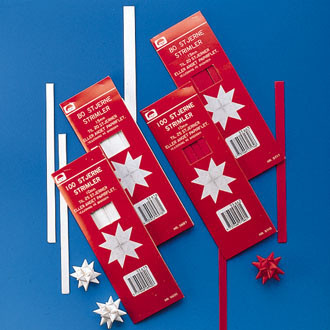 Red and white Pobra paper star kits with pre-cut strips and finished stars.
