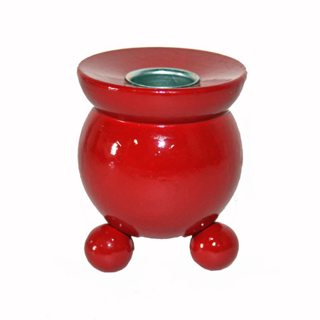Glossy red wooden Swedish candleholder on three ball feet with a metal safety cup.