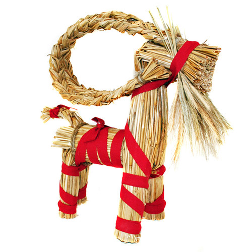 Straw Julbock goat with red ribbon, made of wheat straw, handcrafted in Sweden.