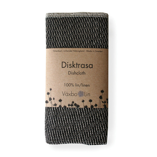 Folded black and white woven linen dishcloth in a paper band labeled Vaxbo Lin.