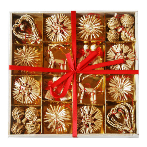 Boxed assortment of straw ornaments, tied with a red ribbon. Natural straw, gold backing.