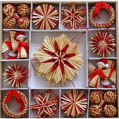 Straw ornament assortment in a box; red and natural wheat straw; various shapes: stars, angels, wreaths, and balls.