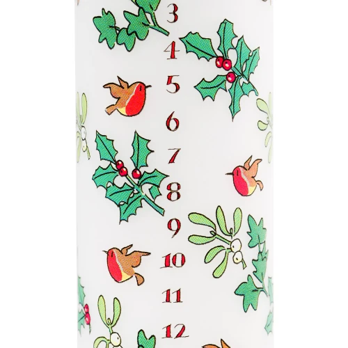 White pillar candle with holly, ivy, and robin illustrations; numbered 3-12 in red.