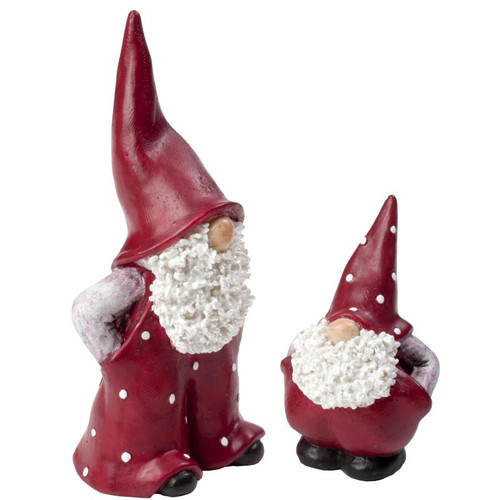 Two ceramic red and white Jultomtar gnomes with textured beards and tall pointed hats.