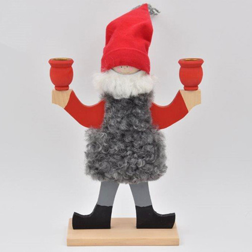 Wooden candleholder shaped like a tomte with a red hat, grey sheepskin vest, and two candle cups.