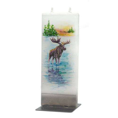 Handmade flat white candle with a hand-painted moose, lake, and trees in a metal stand.