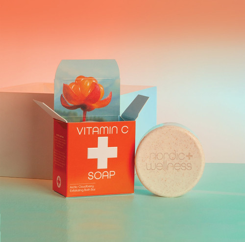Kalastyle Nordic+Wellness Vitamin C Soap box and round bar on a teal surface.