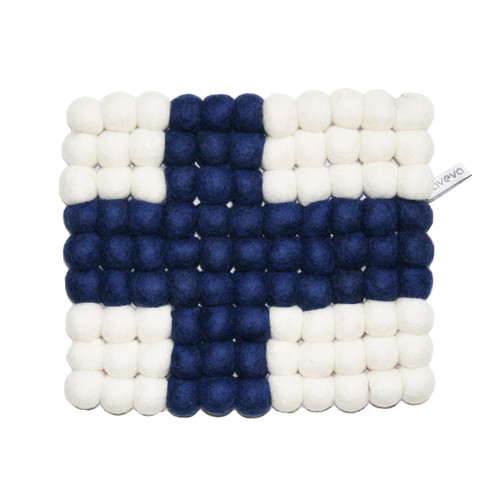 Handmade wool felt ball trivet in the Finnish flag design with blue cross on a white background.