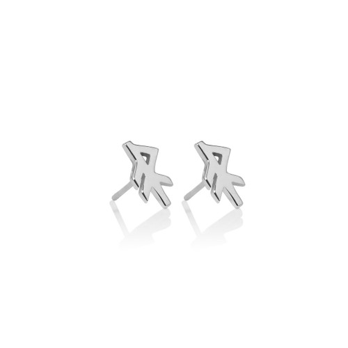 Silver stud earrings, stylized rune shape, reflective surface, white background.