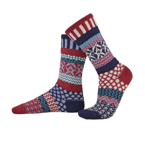 Two mismatched knit crew socks in navy, pomegranate, white, sky blue, and nordico featuring patriotic patterns.