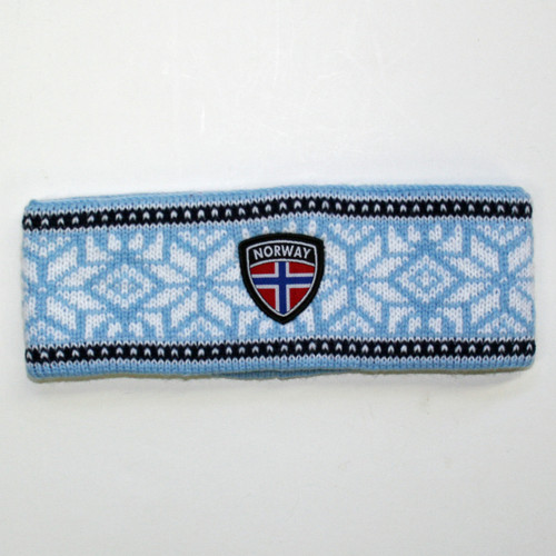 Light blue knit headband with white Nordic snowflakes and a central Norway shield patch.