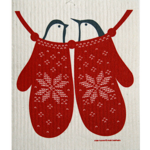 White Swedish dishcloth with two red knit-patterned mittens hanging on a string, each holding a blue bird.