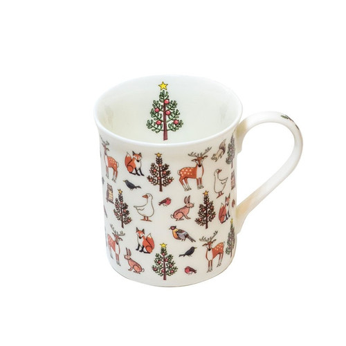 White fine bone china mug decorated with winter wildlife and Christmas trees.