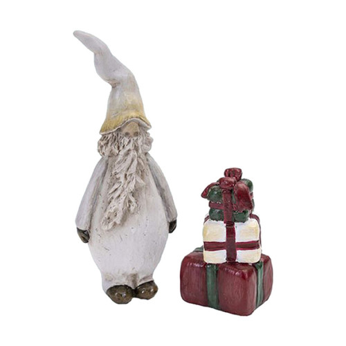 Ceramic Tomte Svante figurine in white with a tall hat, beside a stack of three colorful wrapped gifts.