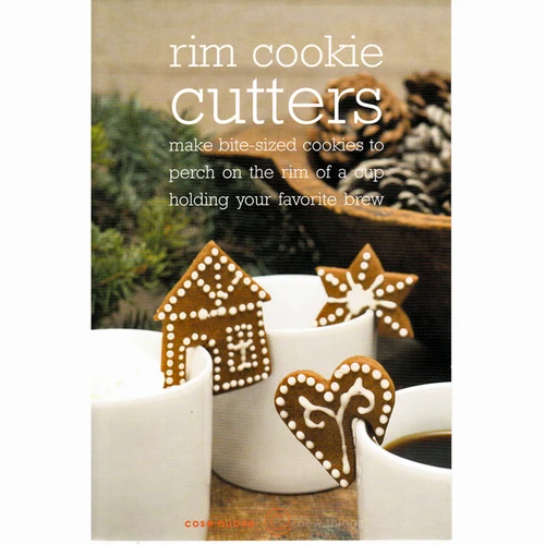 Three gingerbread cookies shaped like a house, star, and heart, decorated with white icing and perched on white coffee mugs.