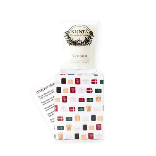 Klinta soy candle in a glass jar with Christmas gift box packaging and card.
