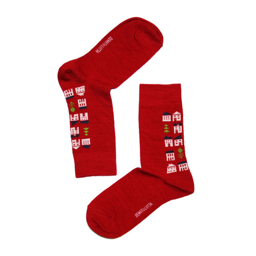 Red woolen socks with a house pattern, angled view, Bengt & Lotta brand.