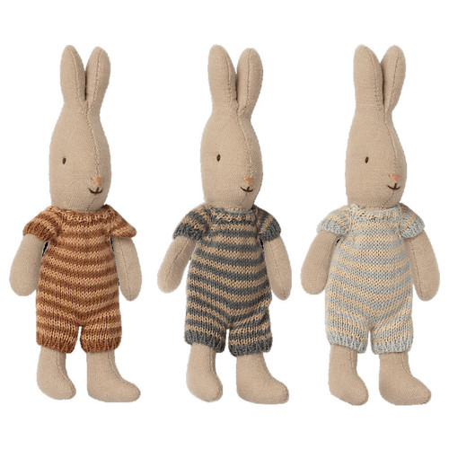Three Maileg micro rabbits in striped knit outfits, brown, grey, and blue.