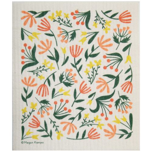 A Swedish dishcloth with a vibrant floral pattern of orange, yellow, and green flowers on a cream background.