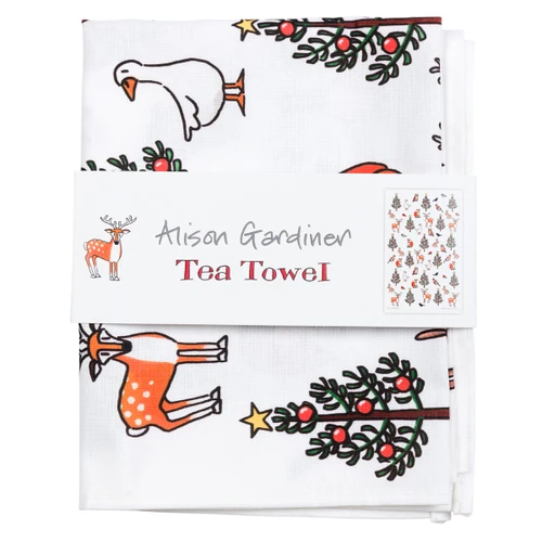 Folded white cotton holiday tea towel featuring a whimsical winter wildlife pattern.