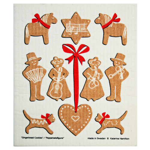 Swedish dishcloth with tan gingerbread figures, red bows, and musical motifs on cream.