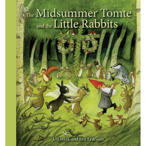 Hardcover book cover with forest scene, rabbits dancing, a gnome playing a flute, and a green border.