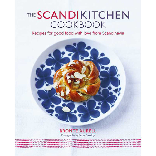 ScandiKitchen cookbook cover featuring a swirled, almond-topped pastry on a blue floral plate.