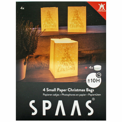Four fireproof paper bags with Christmas text design, glowing with tea lights on steps.