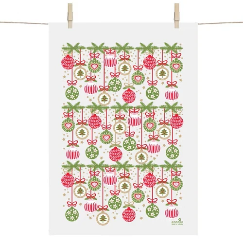 White tea towel hanging from a clothesline, featuring a festive green pine branch and red and green Christmas ornament