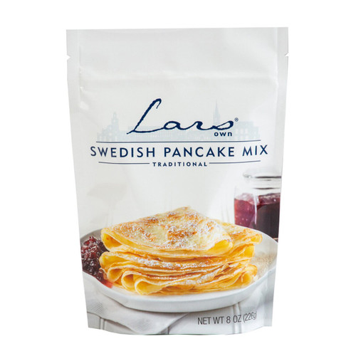White bag of Lars Own Swedish pancake mix, with pancakes and jam.